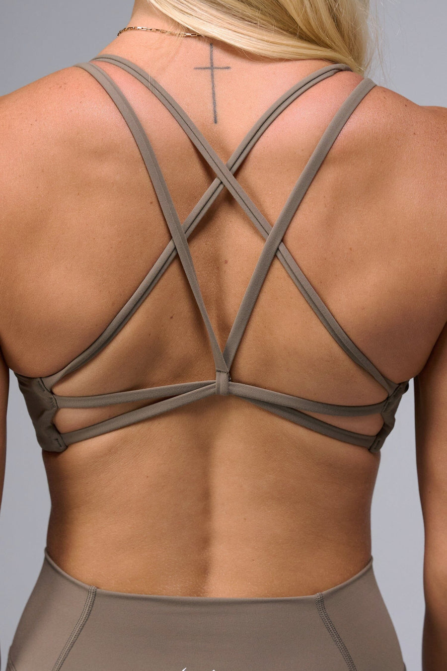 Back View of Brown TLF Tempo Strappy Back Sports Bra, featuring a minimal design for the gym and lifestyle wear