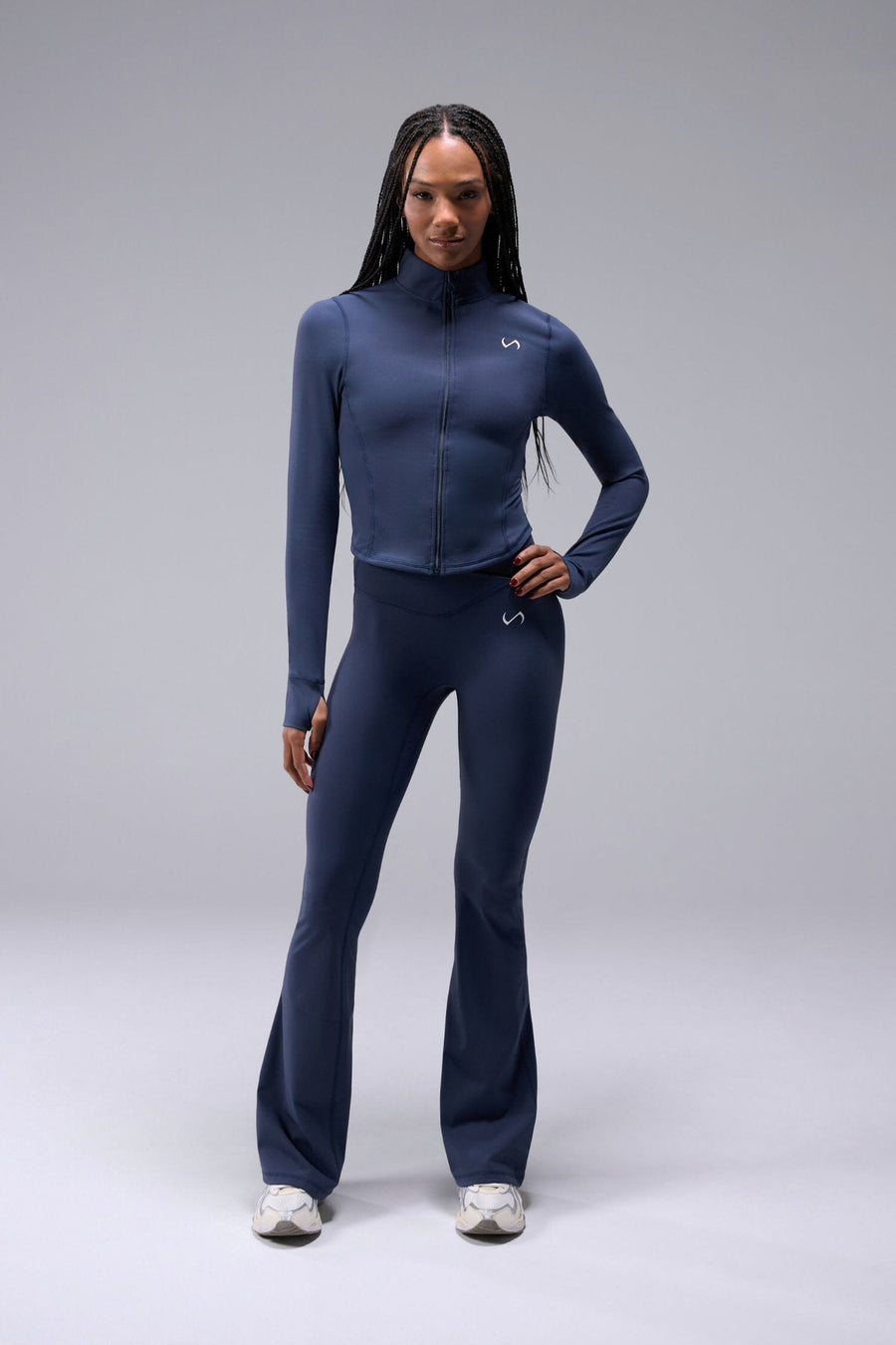Front View of Blue TLF Tempo Cropped Zip Up Jacket featuring thumbholes and cropped length for gym and lifestyle wear