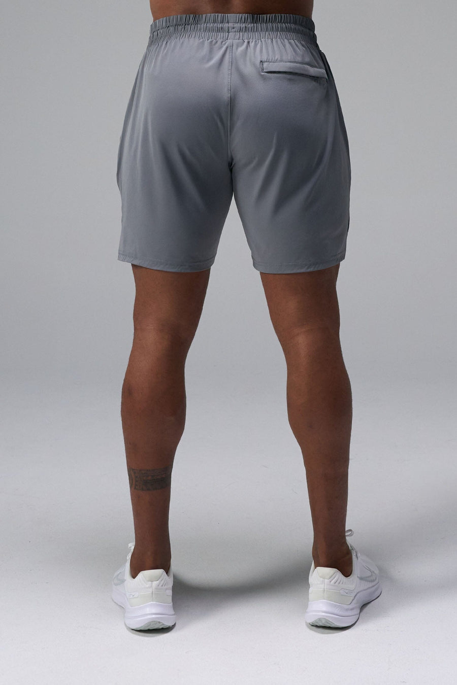 Back View of Gray TLF Train Element 7 Inch Shorts featuring a 7 inch in seam and side zipper pockets designed for optimal performance