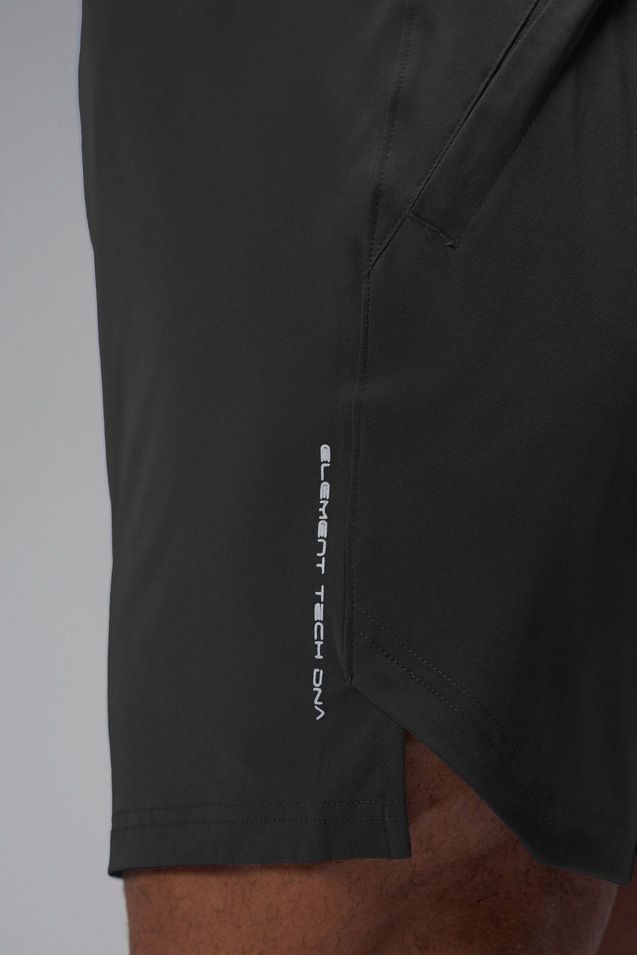 Detail Side View of Black TLF Train Element 7 Inch Shorts featuring a 7 inch in seam and side zipper pockets designed for optimal performance