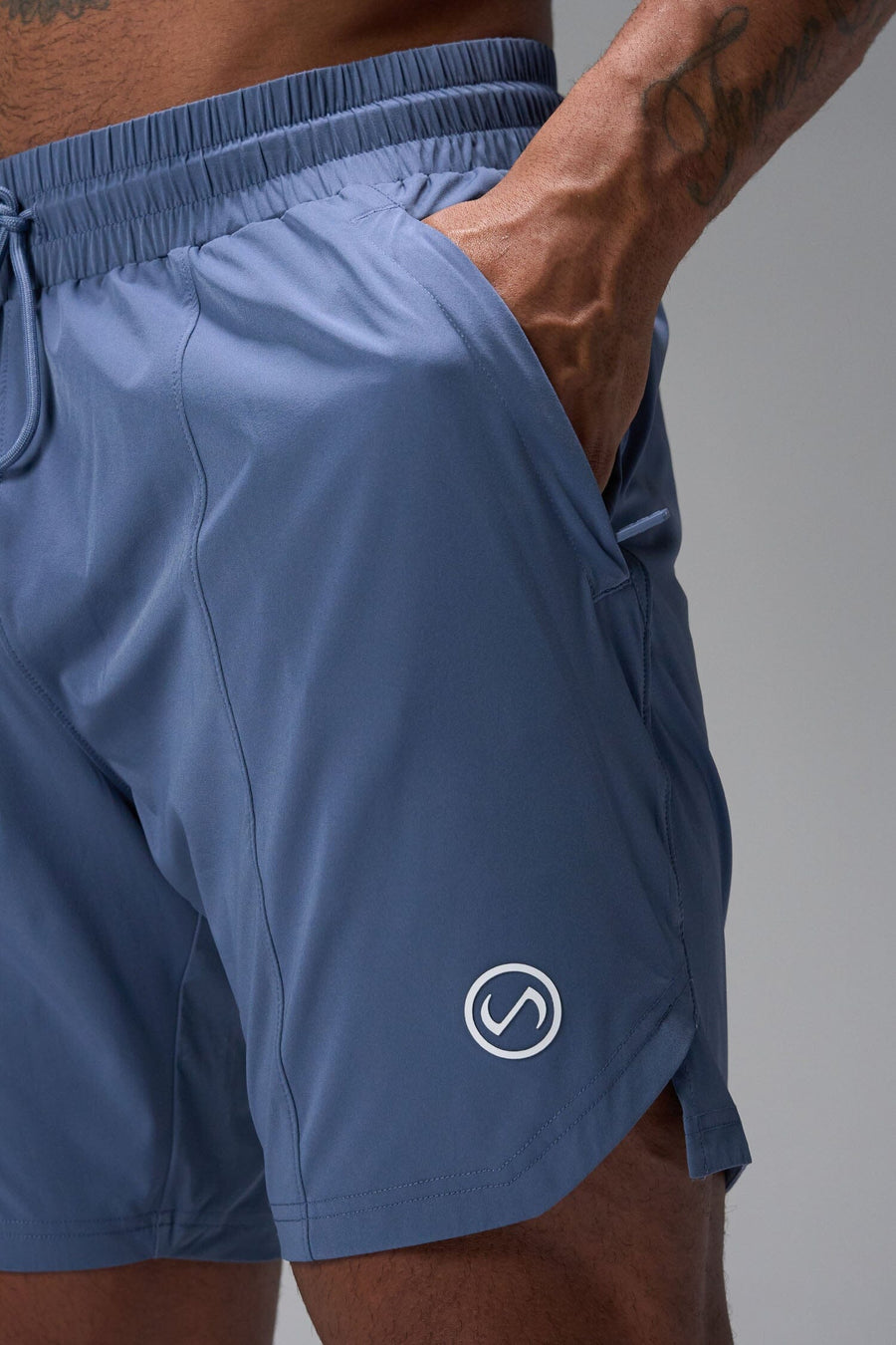 Detail Front View of Blue TLF Train Element 7 Inch Shorts featuring a 7 inch in seam and side zipper pockets designed for optimal performance