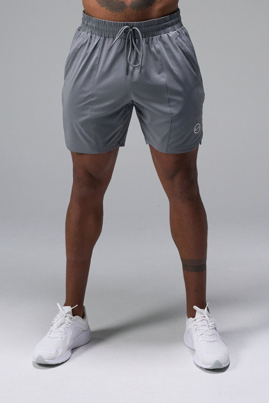 Front View of Gray TLF Train Element 7 Inch Shorts featuring a 7 inch in seam and side zipper pockets designed for optimal performance