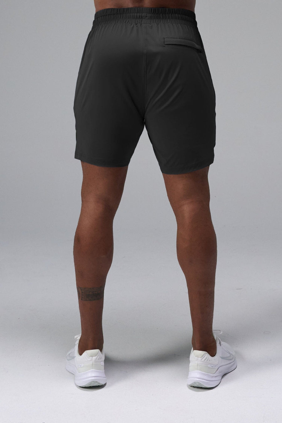 Back View of Black TLF Train Element 7 Inch Shorts featuring a 7 inch in seam and side zipper pockets designed for optimal performance