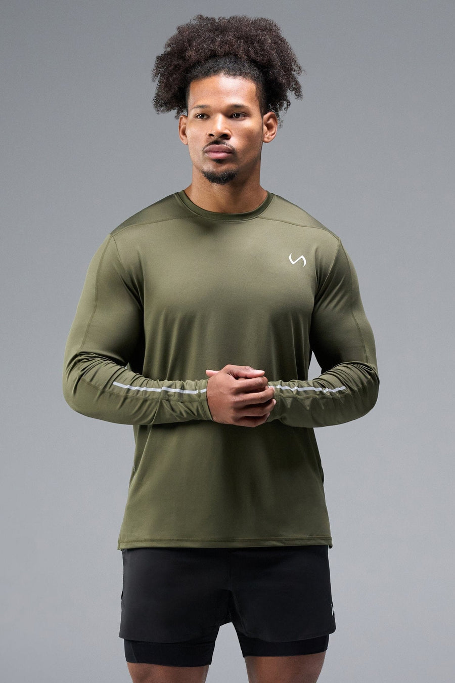 Front View of Green TLF Train Infi-Dry Long Sleeve, featuring our Infi-Dry fabric technology and reflective sleeve design for night running