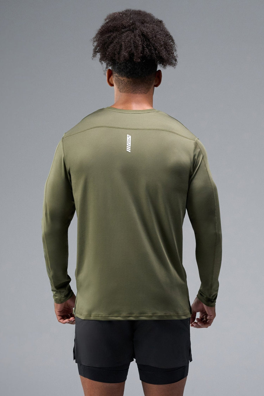 Back View of Green TLF Train Infi-Dry Long Sleeve, featuring our Infi-Dry fabric technology and reflective sleeve design for night running