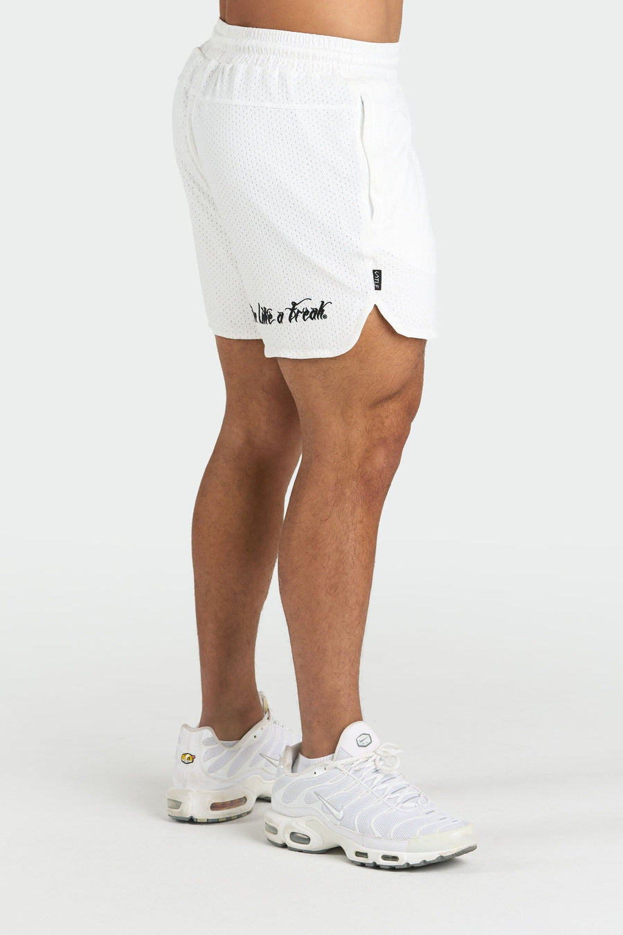 Side View of White Train Like a Freak 5 Inch Mesh Shorts