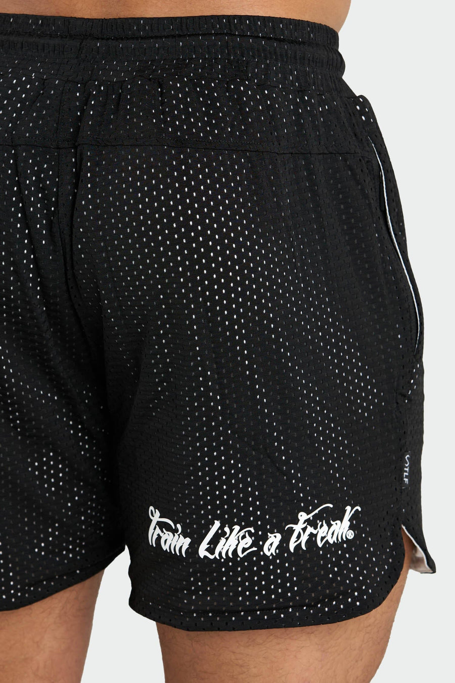 Back View of Black Train Like a Freak 5 Inch Mesh Shorts