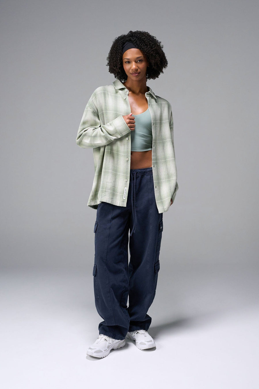 Front View of the Green TLF Flannel Shacket featuring premium embroidery details on the collar and back in a cotton plaid flannel fabric