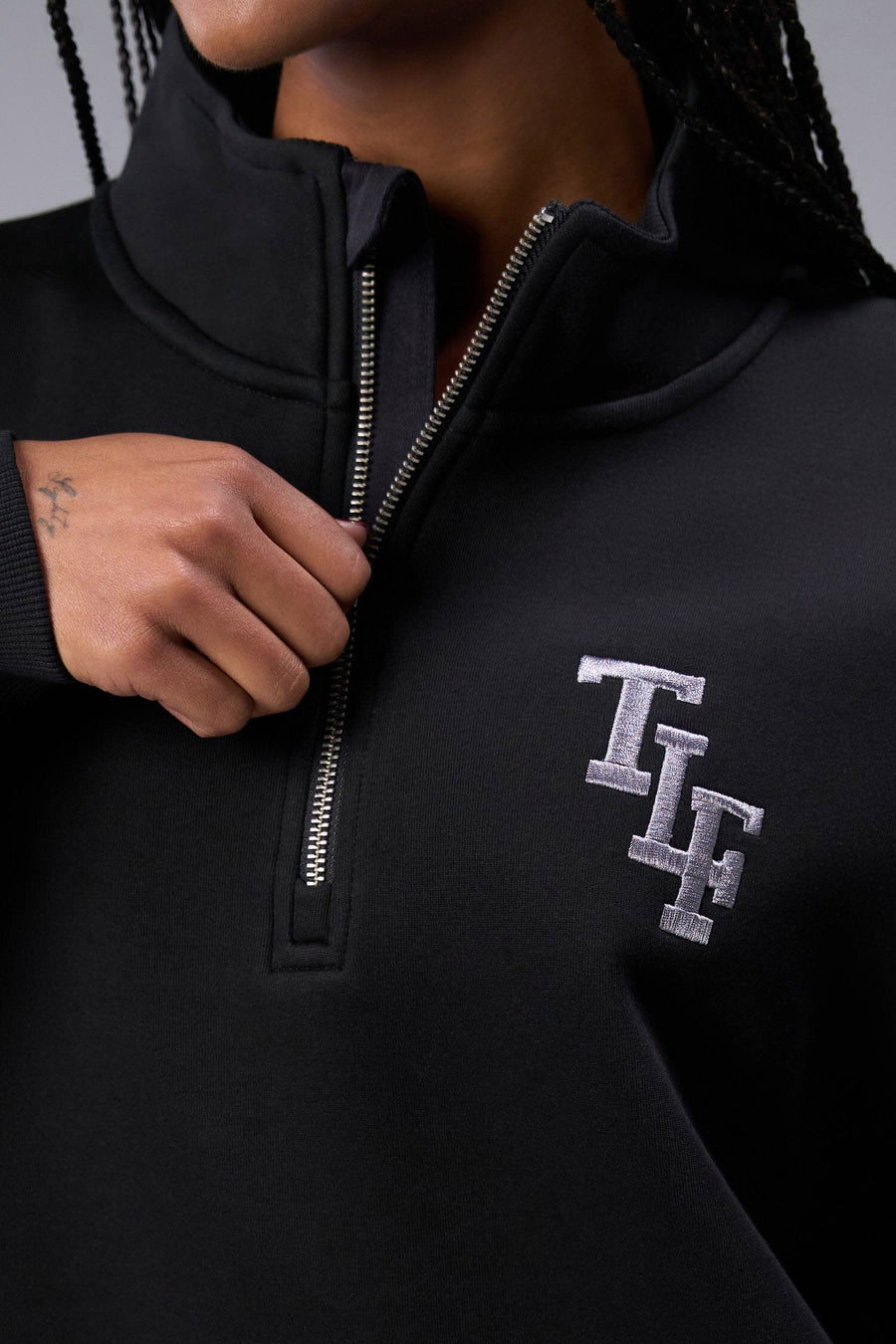 Detail Front View of Black TLF Unisex GTS Scuba Tech Quarter-Zip Pullover, featuring a 1/4 zip pullover sweatshirt with kangaroo pockets