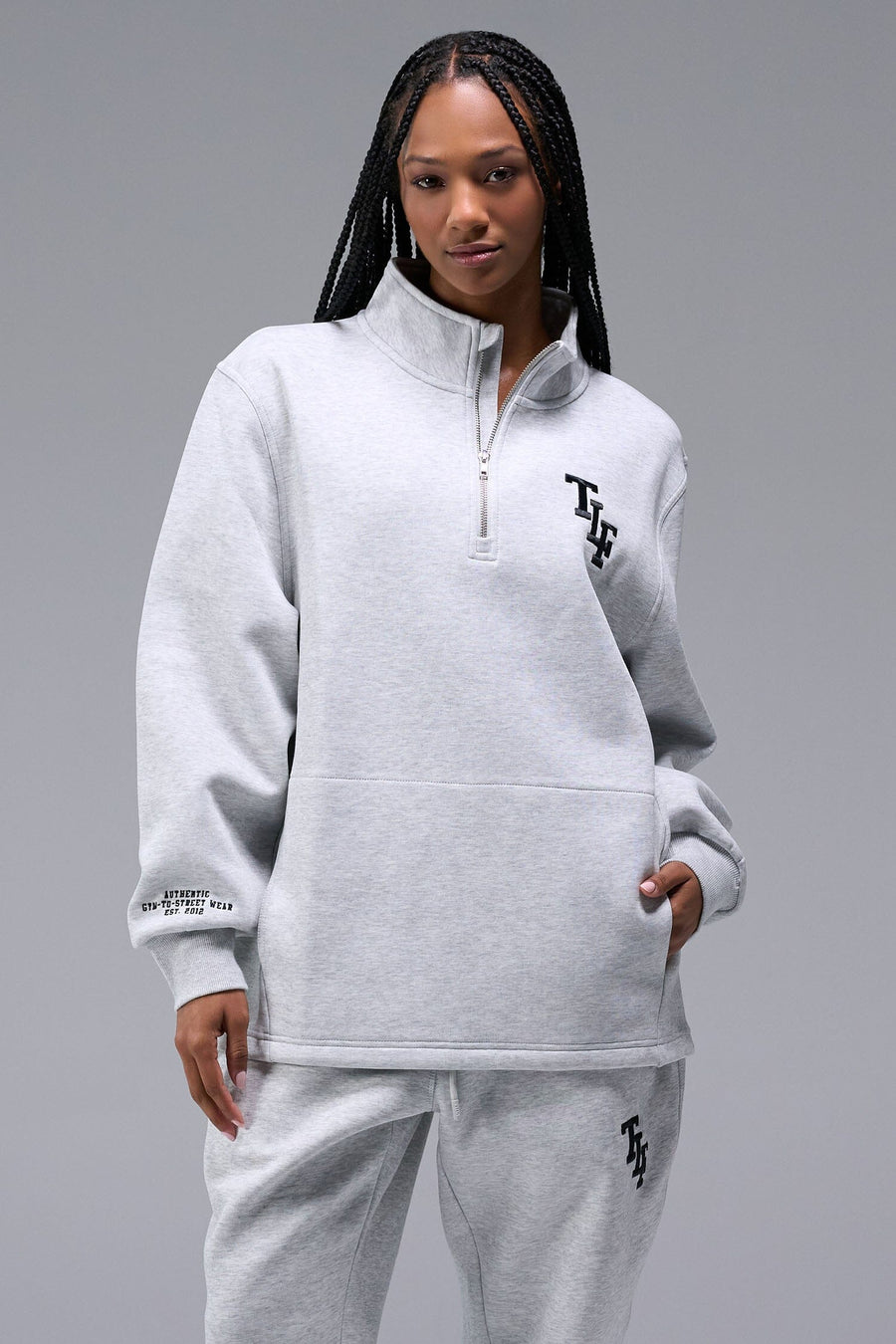 Front View of Light Heather Gray TLF Unisex GTS Scuba Tech Quarter-Zip Pullover, featuring a 1 4 zip pullover sweatshirt with kangaroo pockets