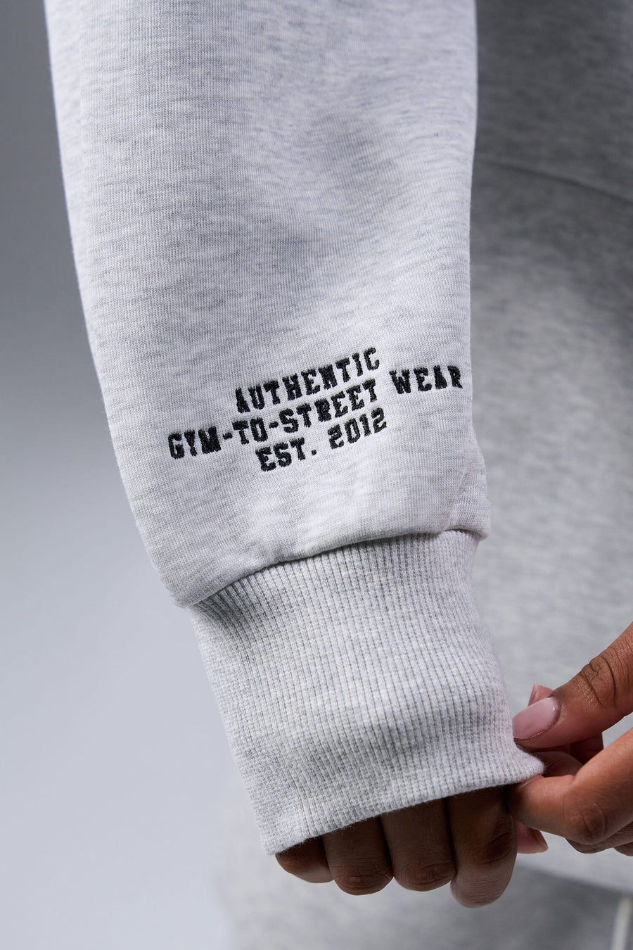Detail Right Sleeve View of Light Heather Gray TLF Unisex GTS Scuba Tech Quarter-Zip Pullover, featuring a 1/4 zip pullover sweatshirt with kangaroo pockets