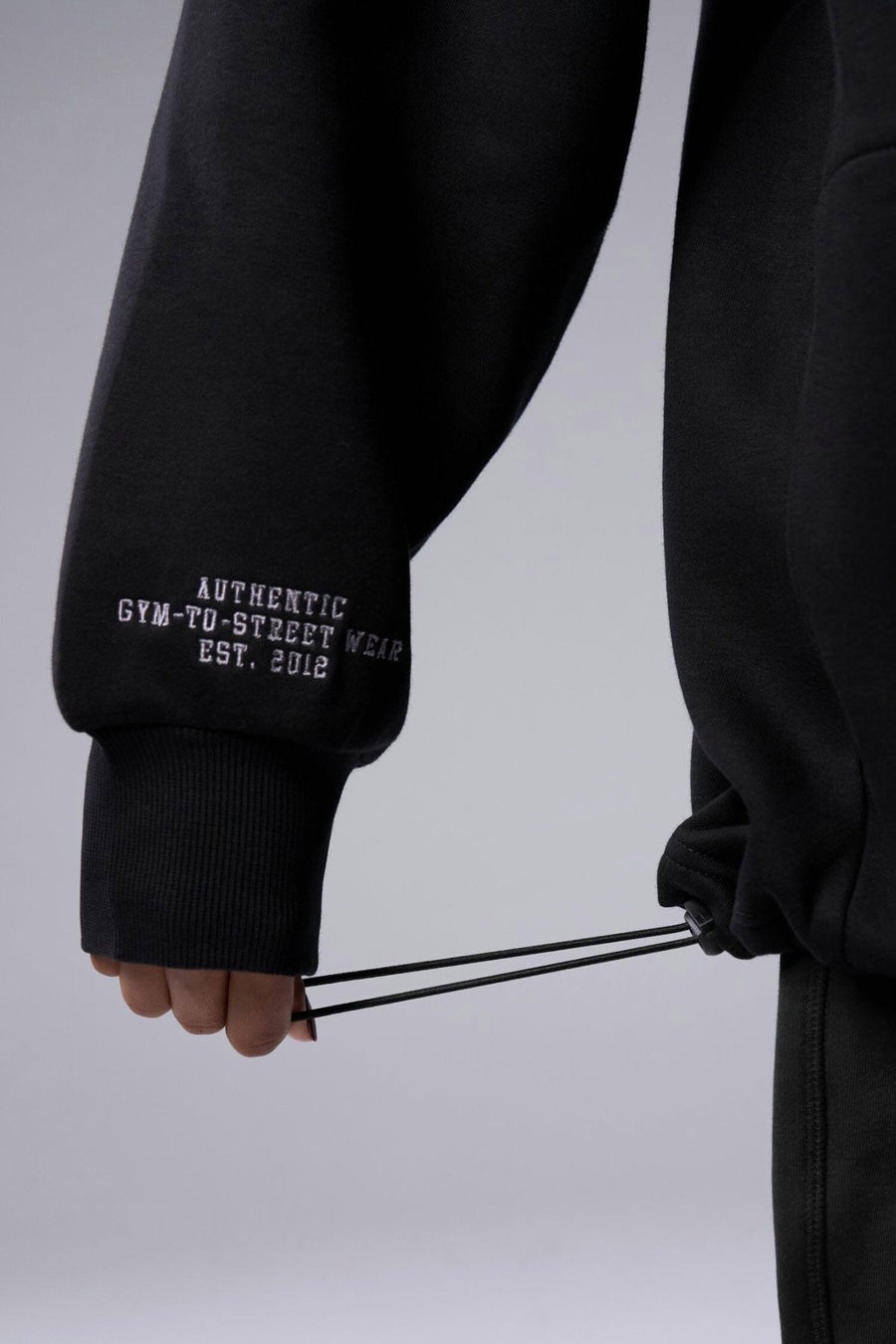 Detail Right Sleeve View of Black TLF Unisex GTS Scuba Tech Quarter-Zip Pullover, featuring a 1/4 zip pullover sweatshirt with kangaroo pockets