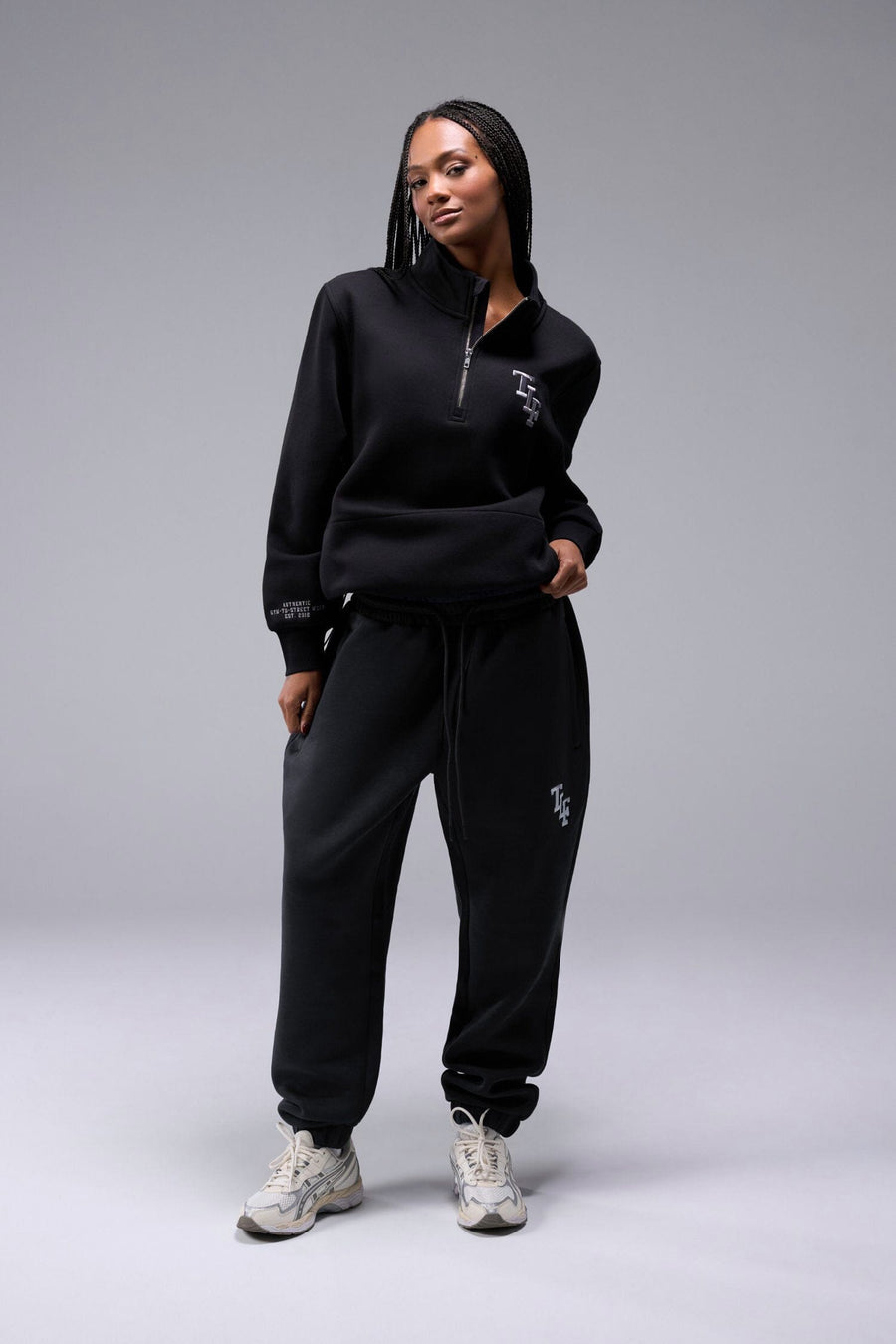 Front View of Black TLF Unisex GTS Scuba Tech Quarter-Zip Pullover, featuring a 1/4 zip pullover sweatshirt with kangaroo pockets