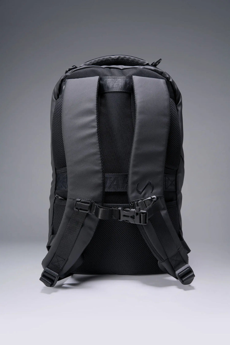 Black Apex Backpack with water-resistant matte PU exterior, dual compartments, and premium debossed straps by TLF Apparel – back view 