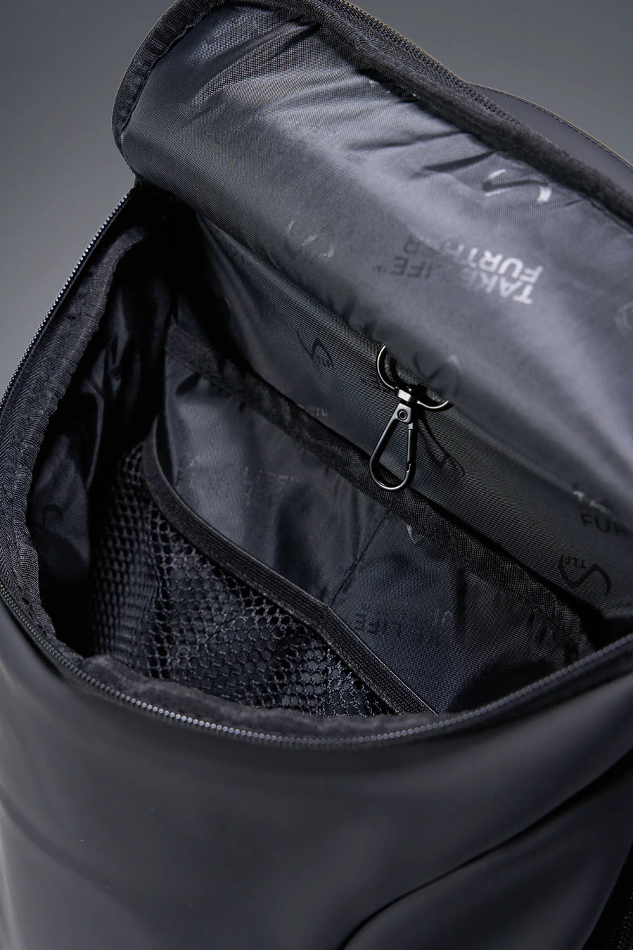 Black Apex Backpack with interior mesh organization, key clip, and padded laptop compartment by TLF Apparel – detail view 