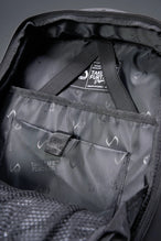 Black Apex Backpack with custom TLF PVC patch and durable matte finish detailing by TLF Apparel – detail view 
