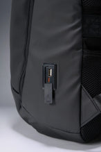 Black Apex Backpack with integrated luggage strap and hidden back zipper pockets for secure storage by TLF Apparel – side view