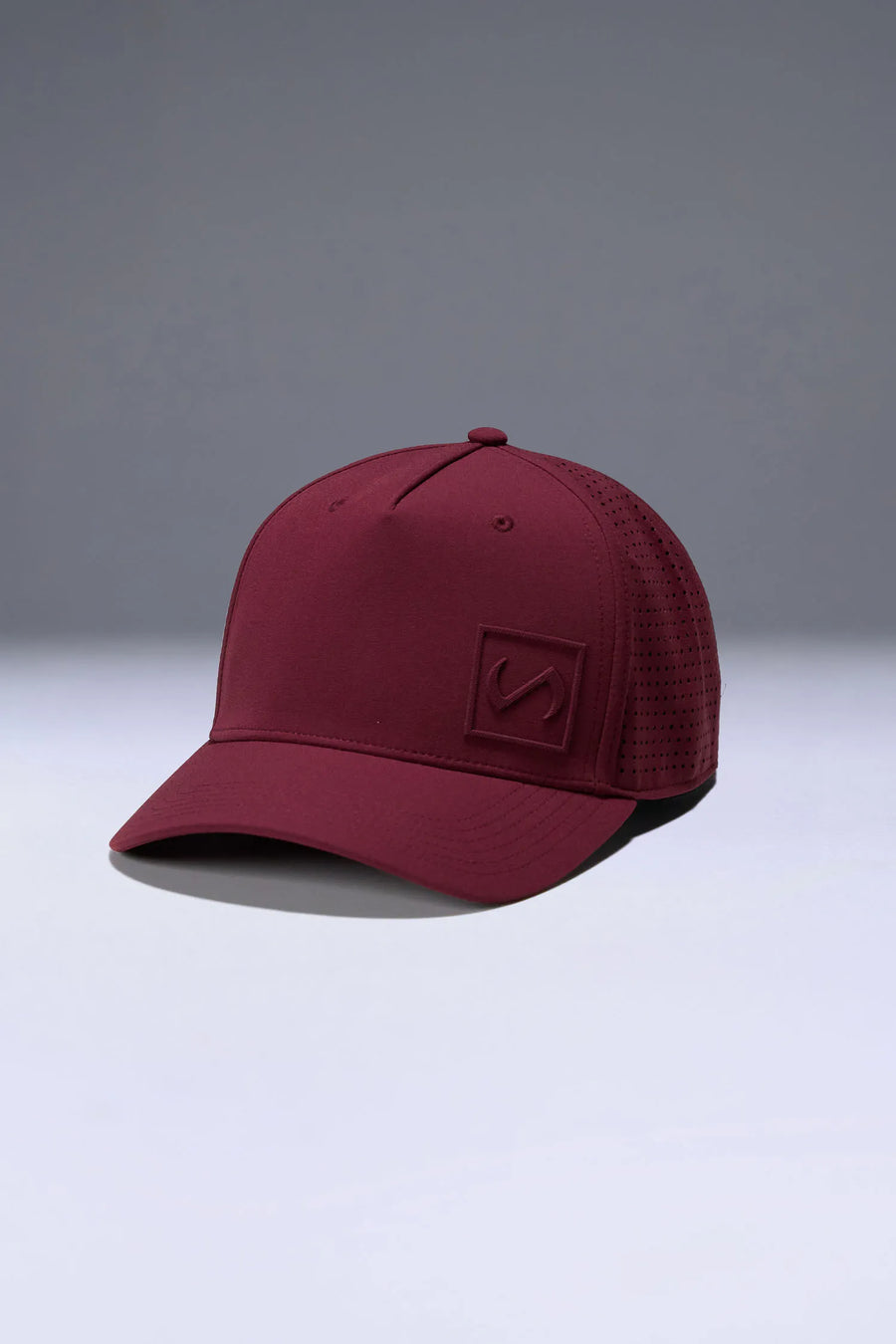 Wine Aero Core Performance Gym Hat with laser ventilation, water-repellent fabric and structured snapback fit by TLF Apparel – front view 