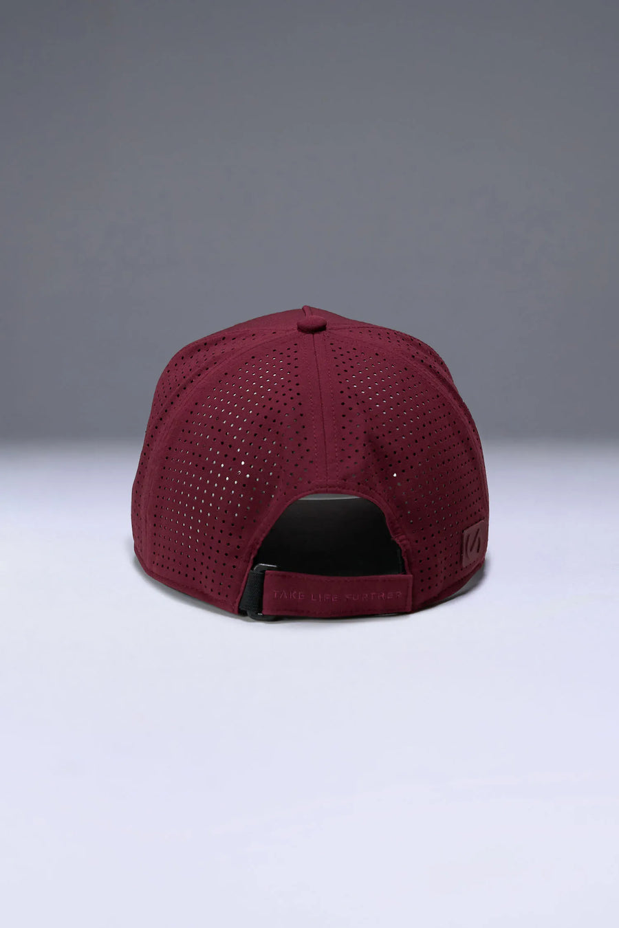 Wine Aero Core Performance Gym Hat with laser ventilation, water-repellent fabric and structured snapback fit by TLF Apparel – back view 