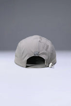 Gray Pluma Packable Hat with adjustable rear bungee cord lock and reflective logo clip label by TLF Apparel – back view 