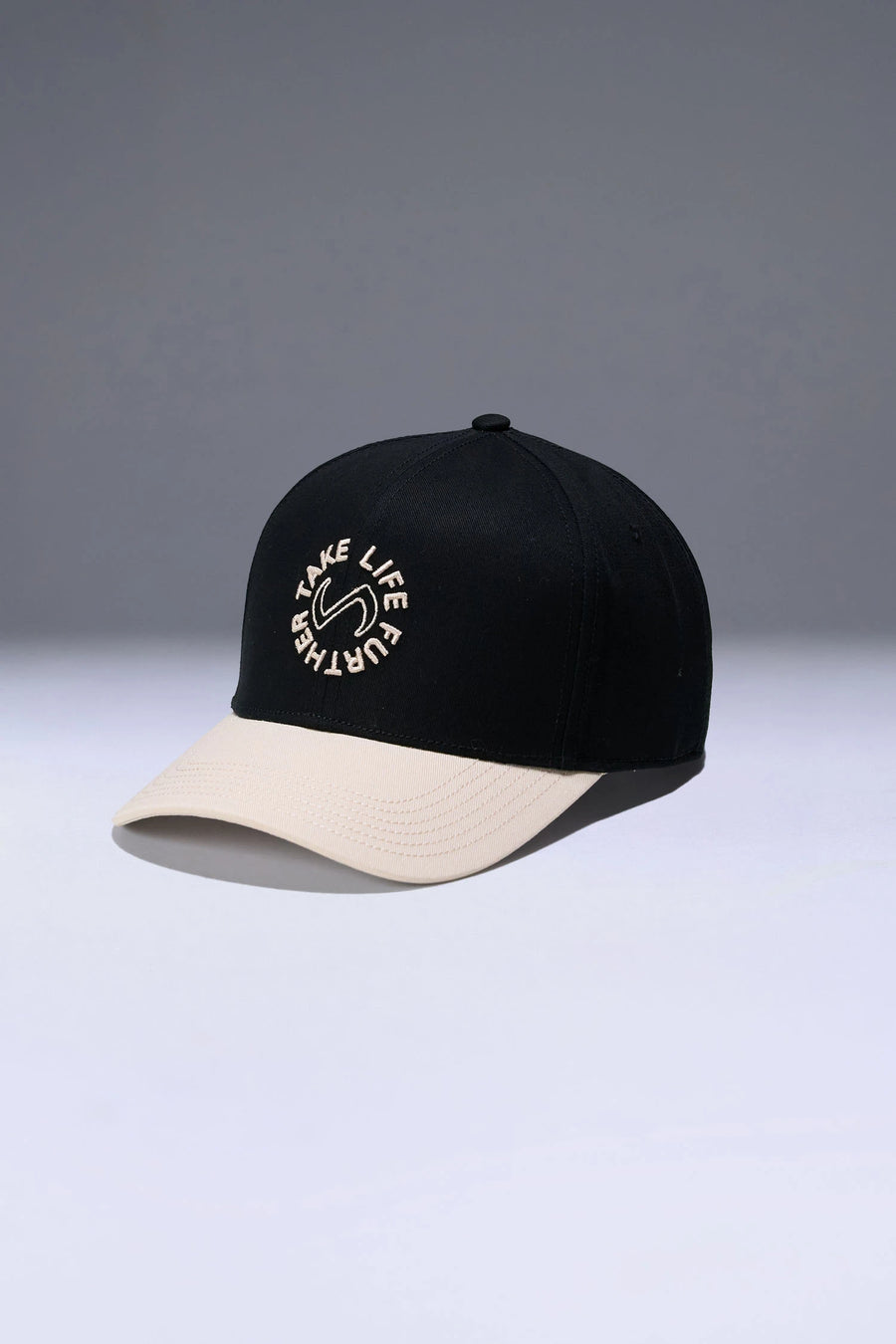 Black/Oat Classic Further Circle Hat with heavyweight cotton twill fabric and front center embroidery for workouts and everyday wear by TLF Apparel – front view