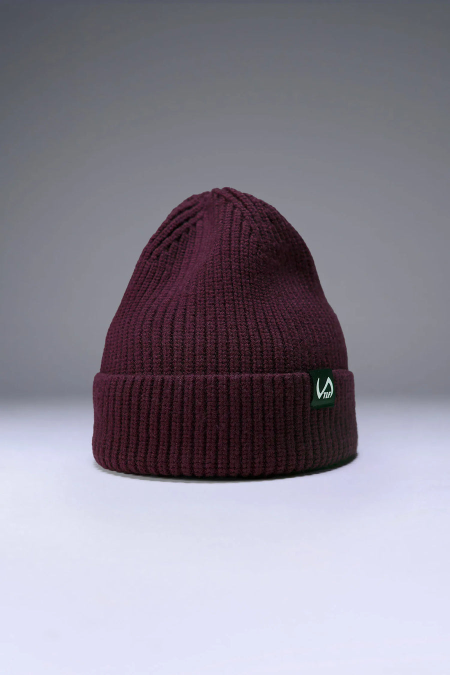 Wine Unisex Cuffed Knit Beanie with a fold over cuff, TLF clip label and uses a premium viscose knit fabric blend for premium comfort by TLF Apparel – front view 