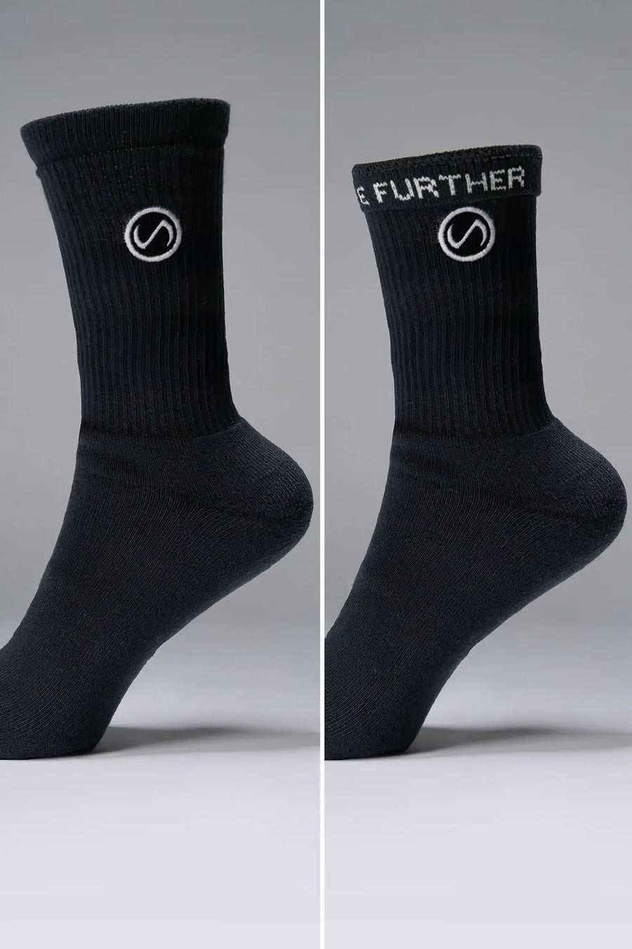 Side View of Black the TLF Evolve Crew Socks featuring an extended cuff height, ribbed cuff, cushioned footbed and seamless toe