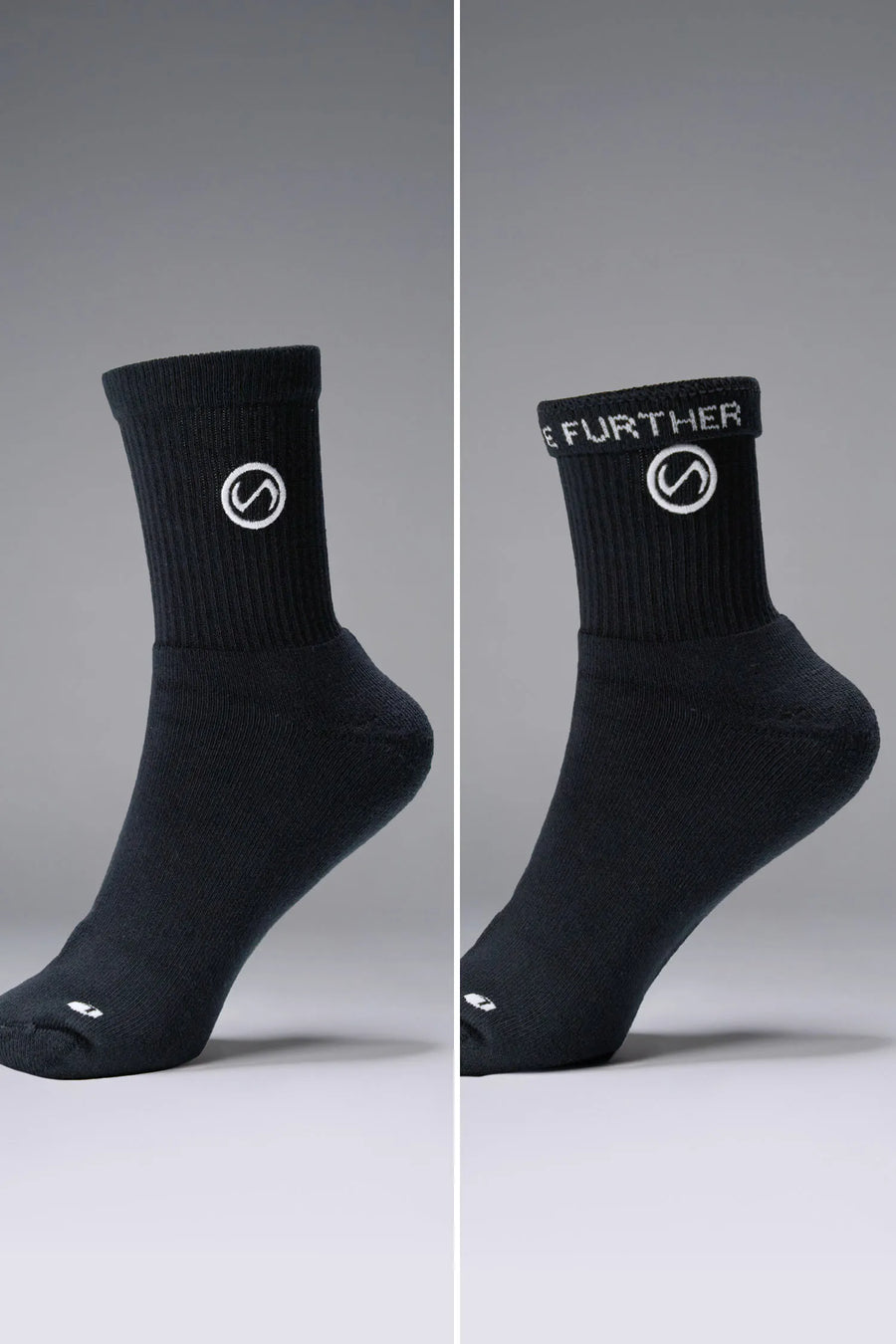 Both Sides View of Black the TLF Evolve Half Crew Socks featuring an extended cuff height, ribbed cuff, cushioned footbed and seamless toe