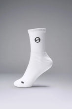 Front View of White the TLF Evolve Half Crew Socks featuring an extended cuff height, ribbed cuff, cushioned footbed and seamless toe