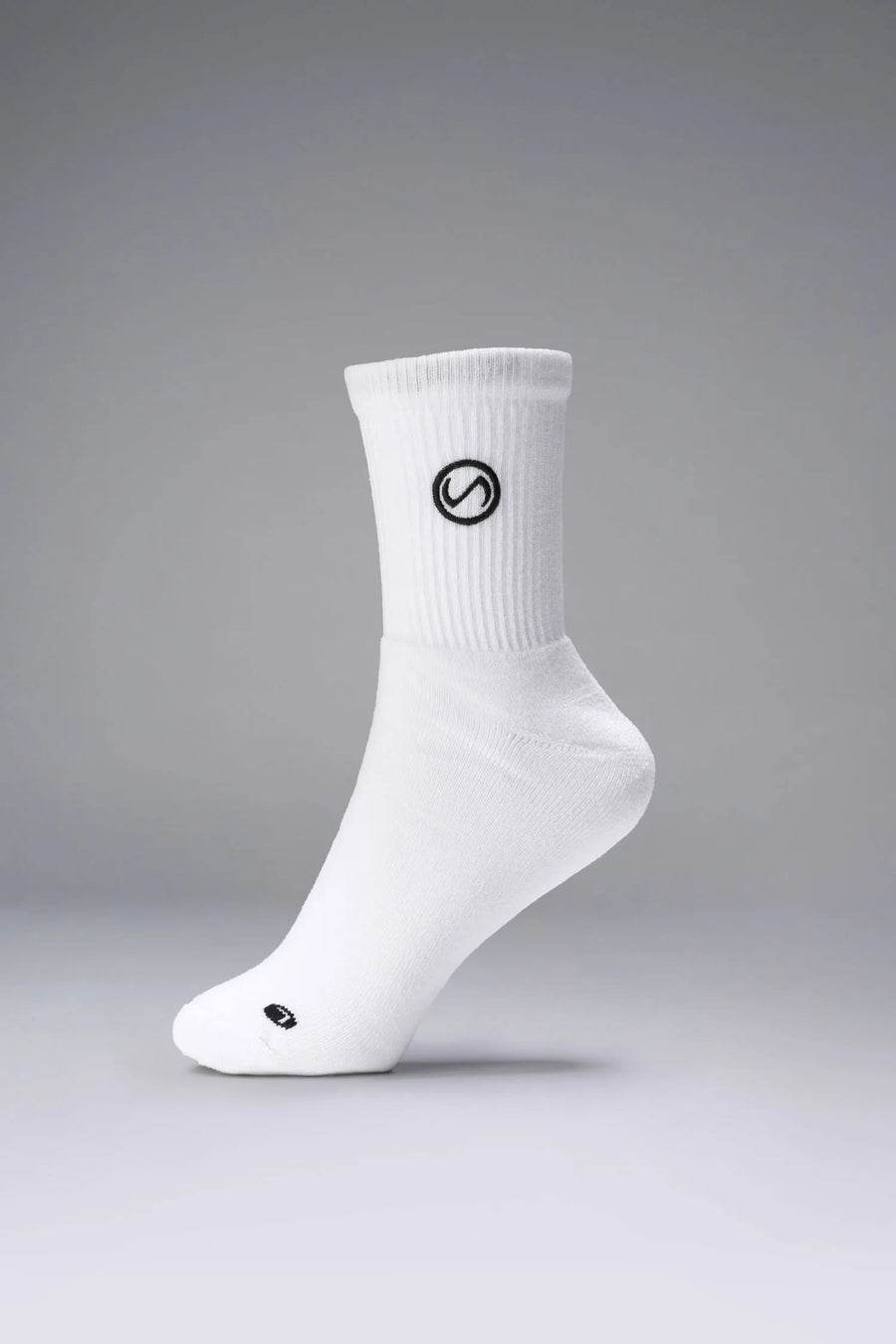 Front View of White the TLF Evolve Half Crew Socks featuring an extended cuff height, ribbed cuff, cushioned footbed and seamless toe