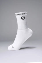 Side View of White the TLF Evolve Crew Socks featuring an extended cuff height, ribbed cuff, cushioned footbed and seamless toe