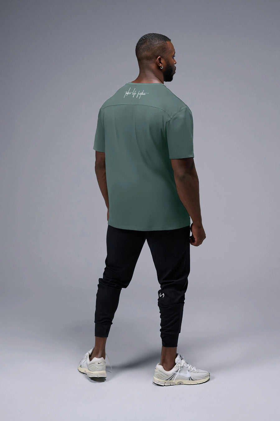 Side View Of Back Script Oversized Tee in Green