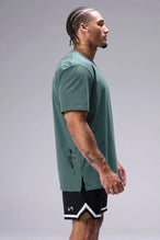 Green Classic Script Cotton Luxe Oversized Tee showing side split hem and gym-to-street fit by TLF Apparel – side view