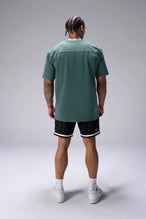 Green Classic Script Cotton Luxe Oversized Tee showing back yoke detail and rear right script logo by TLF Apparel – back view 