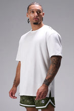 White Classic Script Cotton Luxe Oversized Tee with minimal branding and oversized fit by TLF Apparel – front view
