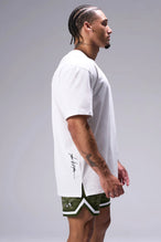 White Classic Script Cotton Luxe Oversized Tee showing side split hem and gym-to-street fit by TLF Apparel – side view