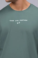 Front View Of Take Life Further Oversized Tee in Green