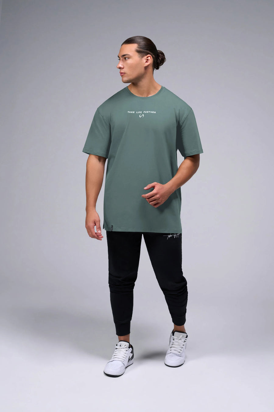 Front View Of Take Life Further Oversized Tee in Green