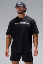 Black Take Life Further Oversized Tee with minimal chest graphic and oversized fit by TLF Apparel – front view 
