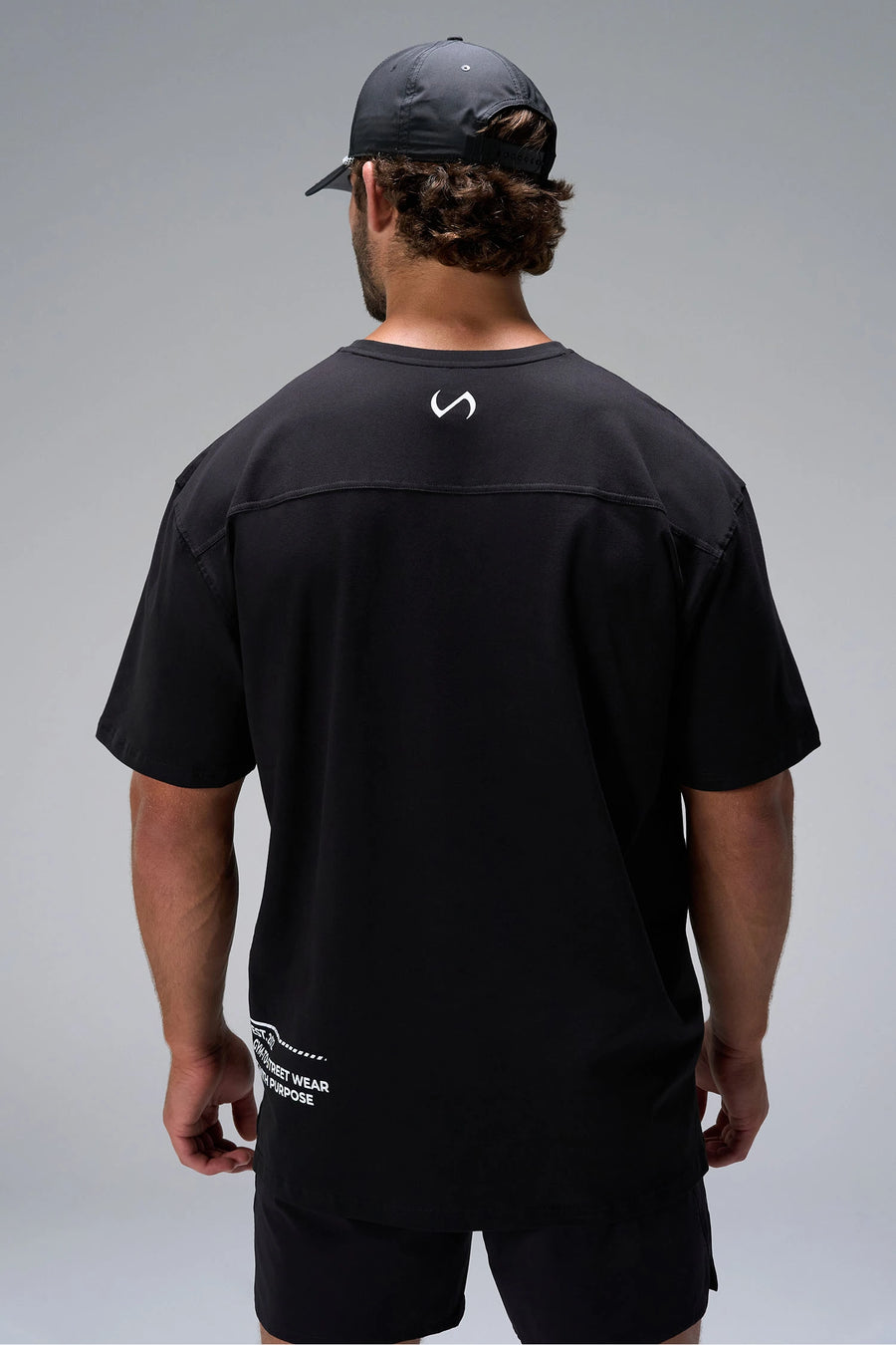 Black Take Life Further Oversized Tee showing Est 2012 Gym-To-Street back hem callout by TLF Apparel – back view