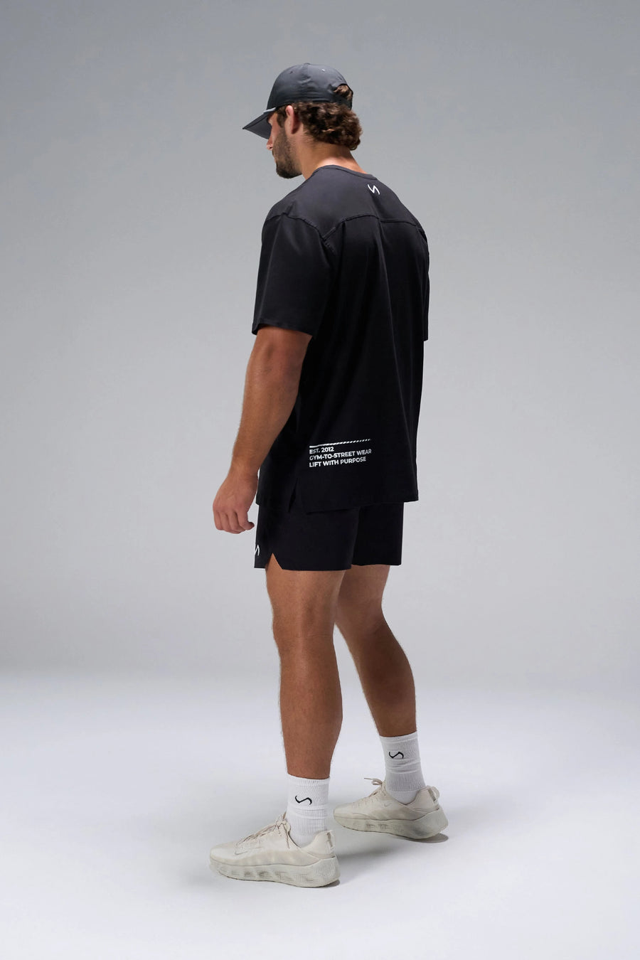 Black Take Life Further Oversized Tee showing relaxed oversized fit in 93% cotton 7% elastane by TLF Apparel – side view 