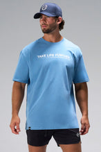Blue Take Life Further Oversized Tee with minimal chest graphic and oversized fit by TLF Apparel – front view 