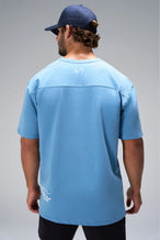 Blue Take Life Further Oversized Tee showing Est 2012 Gym-To-Street back hem callout by TLF Apparel – back view 