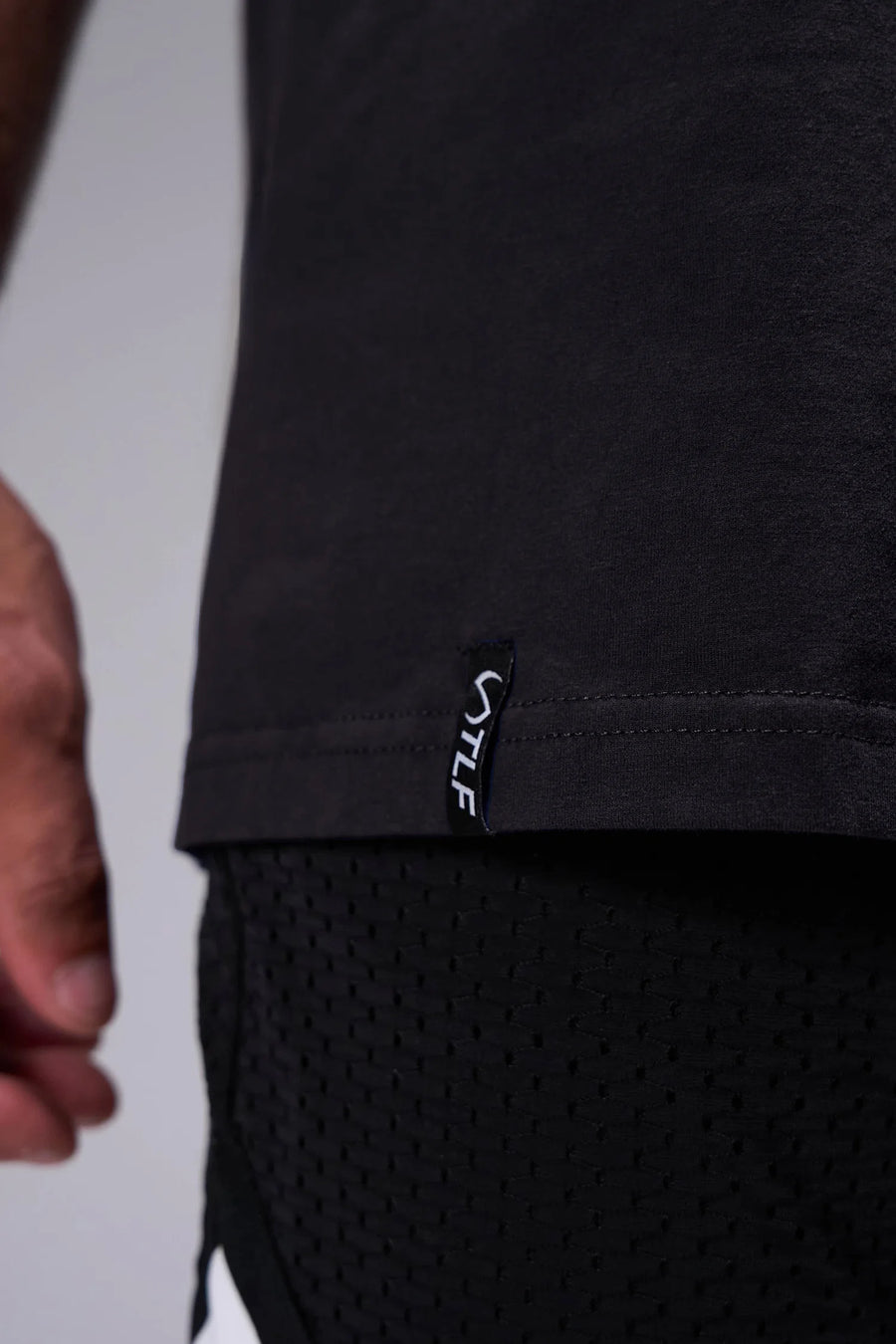 Black Ronnie Coleman “signature” Tee showing Ronnie Coleman x TLF chest logo and ultra-soft Cotton Luxe DNA™ fabric by TLF Apparel – detail view