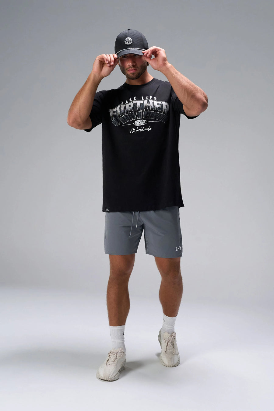 Black Take Life Further Oversized Tee with arched collegiate Take Life Further chest graphic by TLF Apparel – front view 