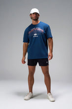 Blue Take Life Further Oversized Tee showing distressed varsity chest print, EST 2012 globe crest, and Cotton Luxe DNA fabric by TLF Apparel – front view 