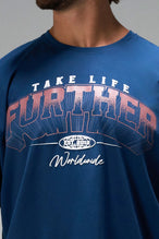 Blue Take Life Further Oversized Tee with arched collegiate Take Life Further chest graphic by TLF Apparel – detail view