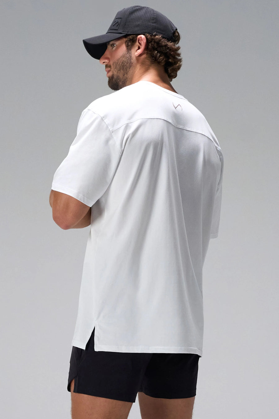 White Take Life Further Oversized Tee showing side split hem and gym-to-street fit by TLF Apparel – side view