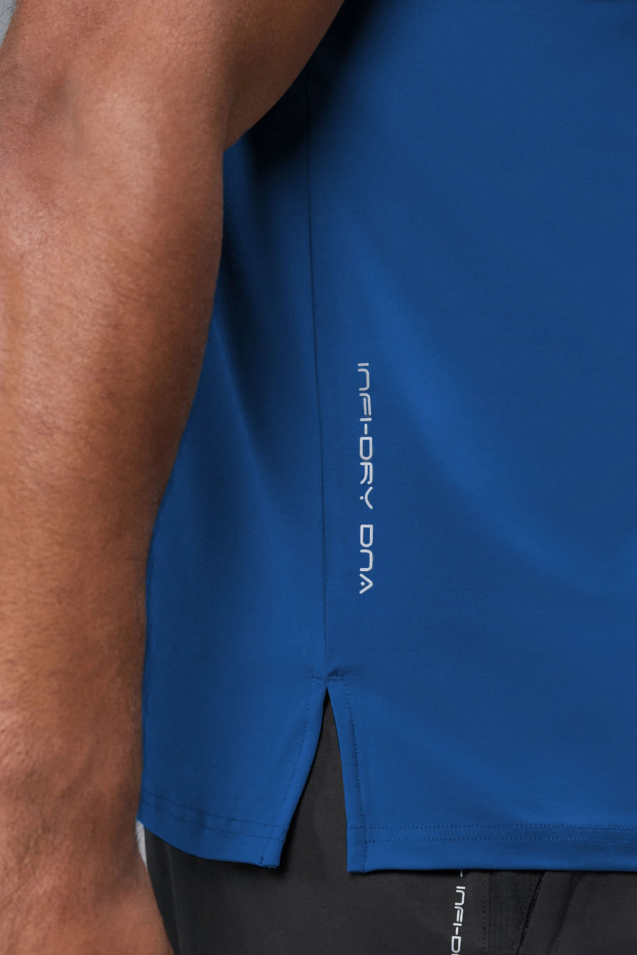 Detail View of Blue TLF Infi-Dry Swole Tee, crafted with our custom swole fit and utilizing our infi-dry fabric technology 