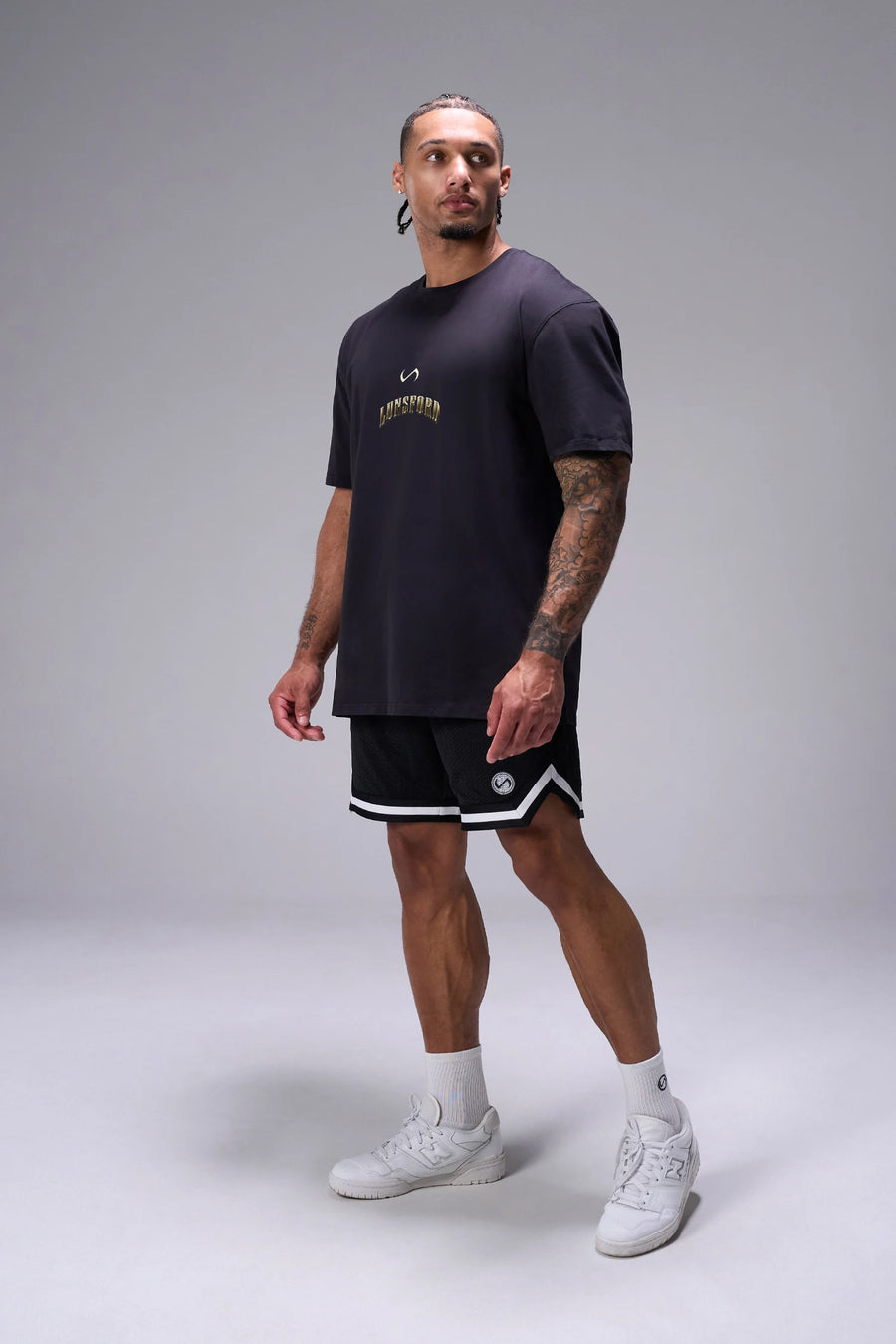 Black Derek Lunsford x TLF Cotton Luxe Oversized Tee showing relaxed oversized fit in 93% cotton 7% elastane by TLF Apparel – side view
